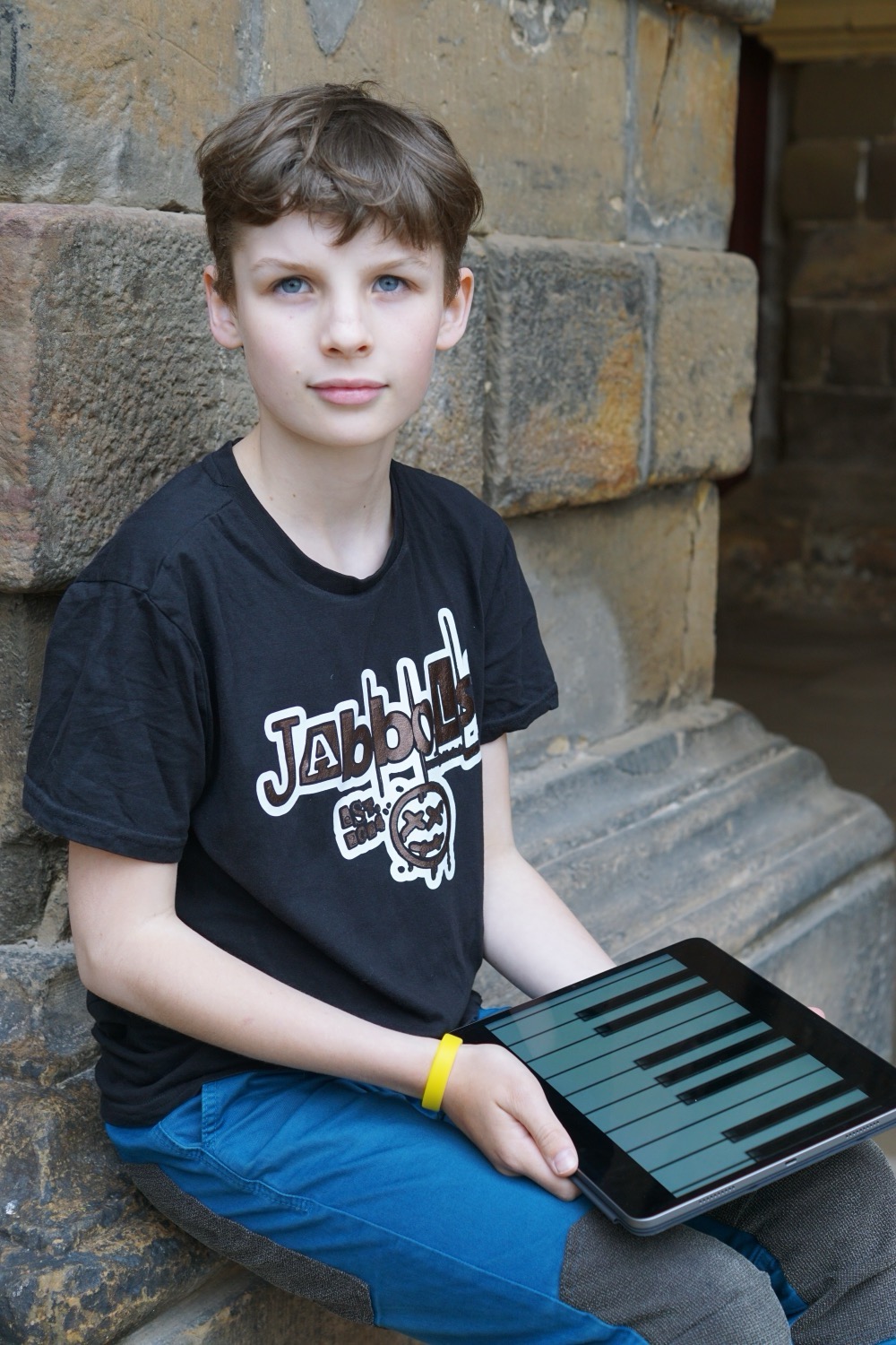 Barber 1 young man with beard smiling and wearing a  brown shirt